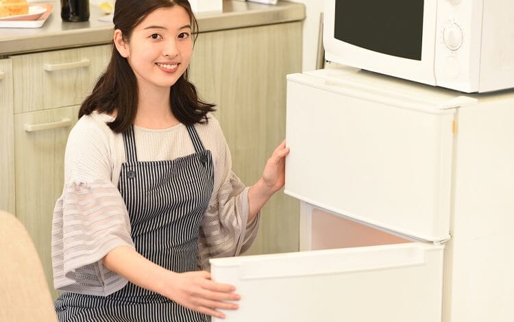 Woman opening a refrigerator